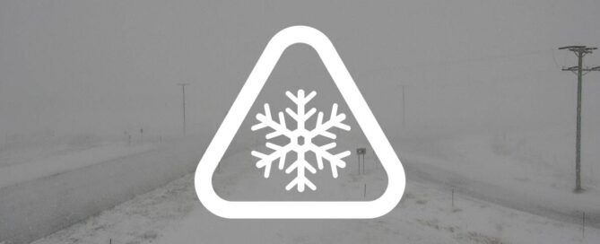 weather alert using a snowflake and caution sign
