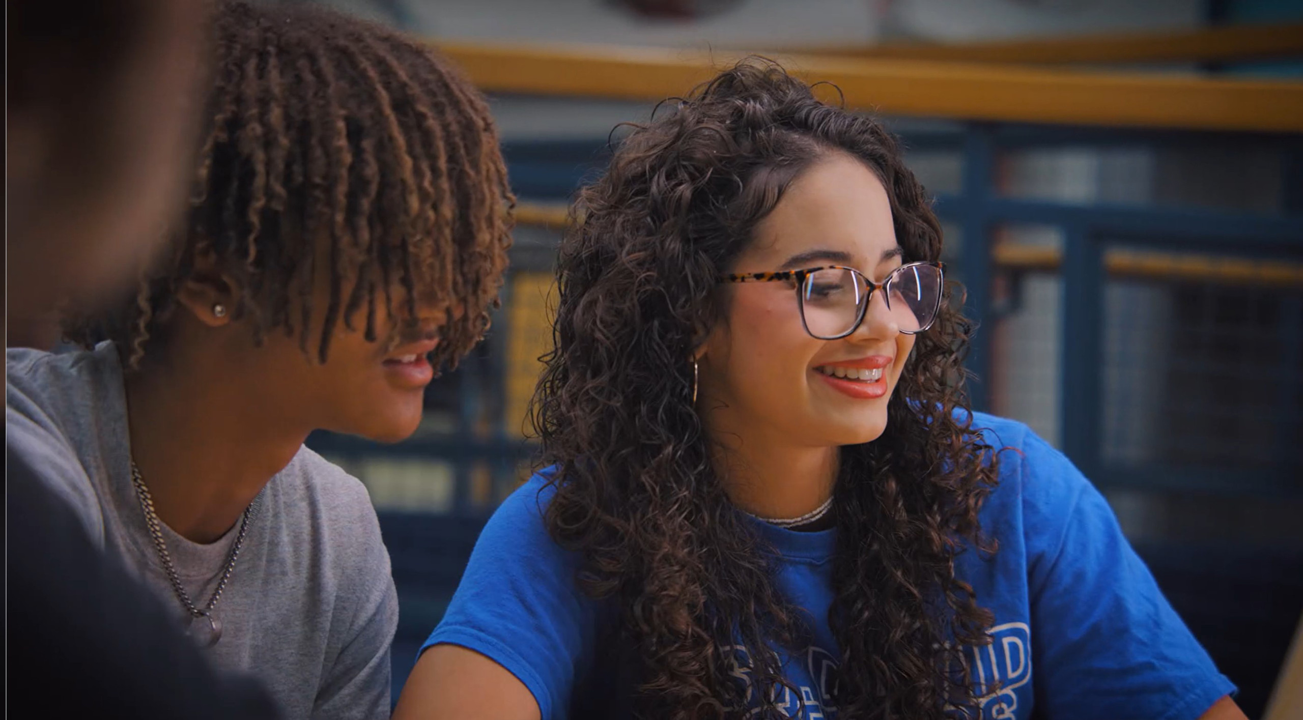 Image of two students in conversation