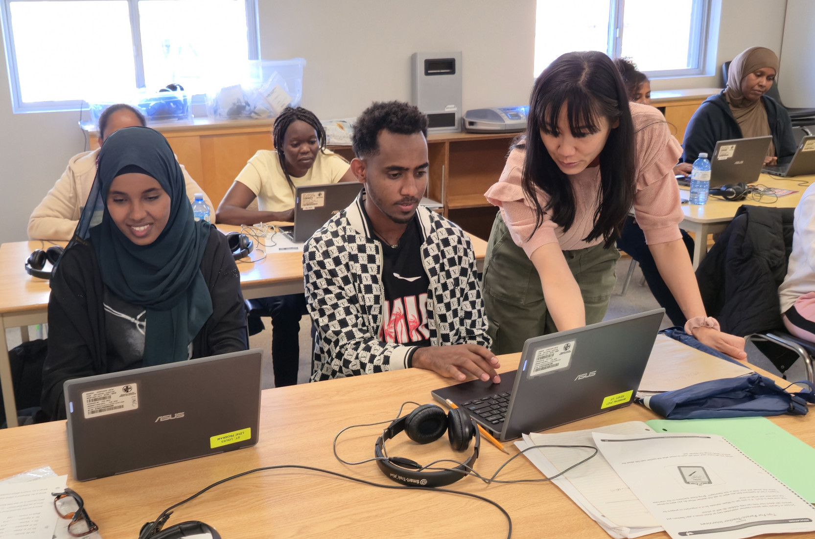 Students receiving help during LINC Classes at St. Louis