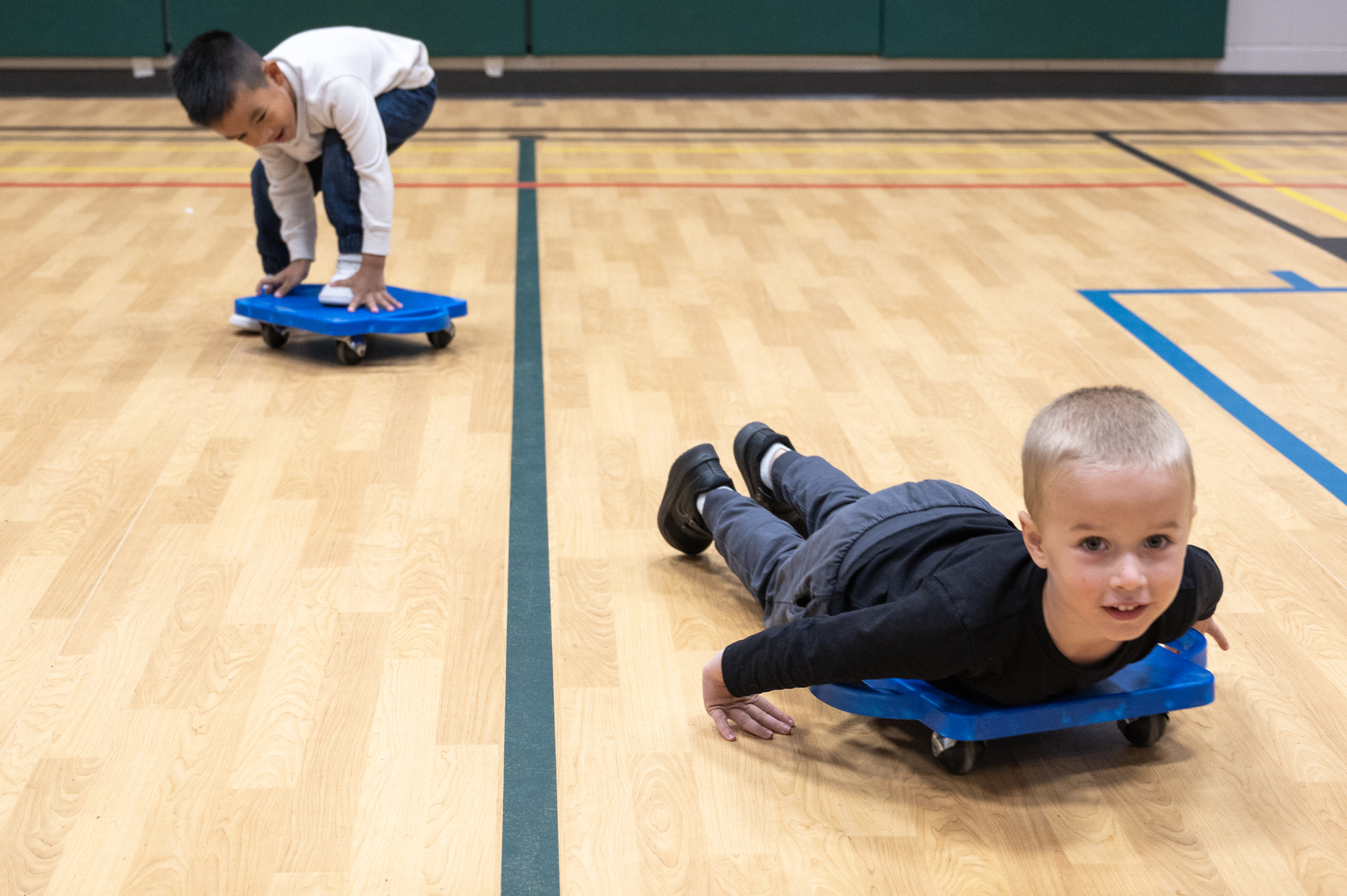 Children on scooter boards