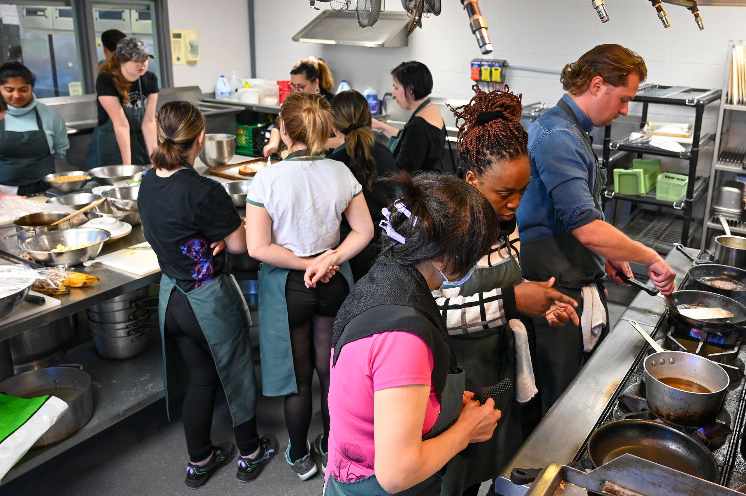Students participating in a culinary class at St. Louis