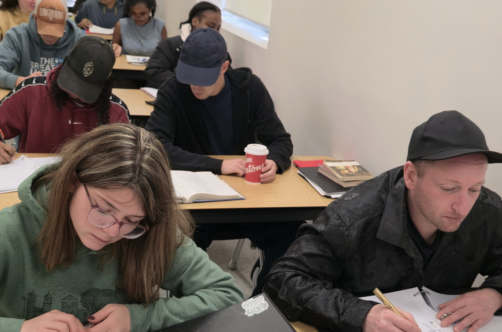 Students seated at desks in SSC Day Class at St. Louis