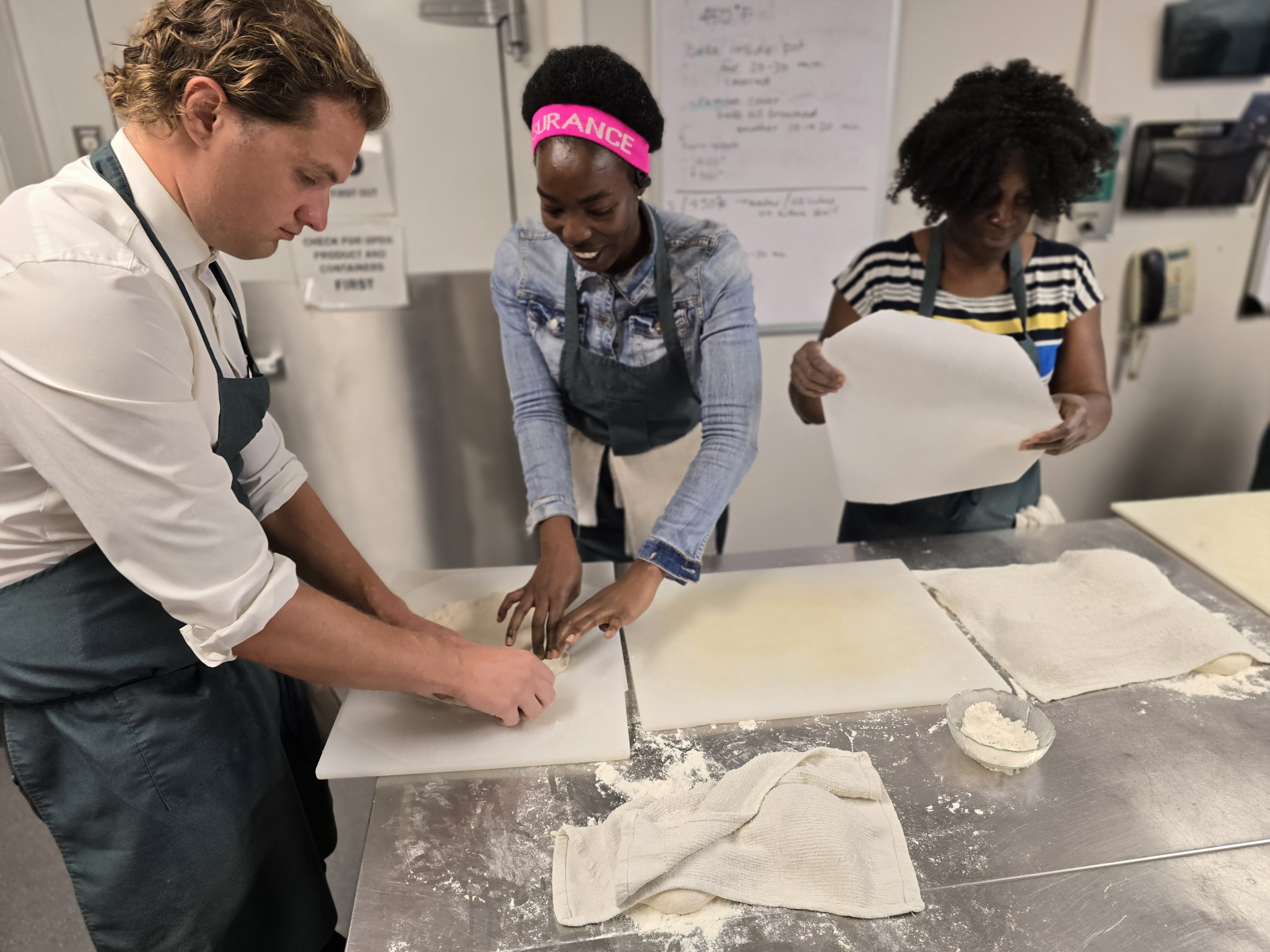 Three Students Preparing Food at the St. Louis Culinary Program Three Students Preparing Food at the St. Louis Culinary Program