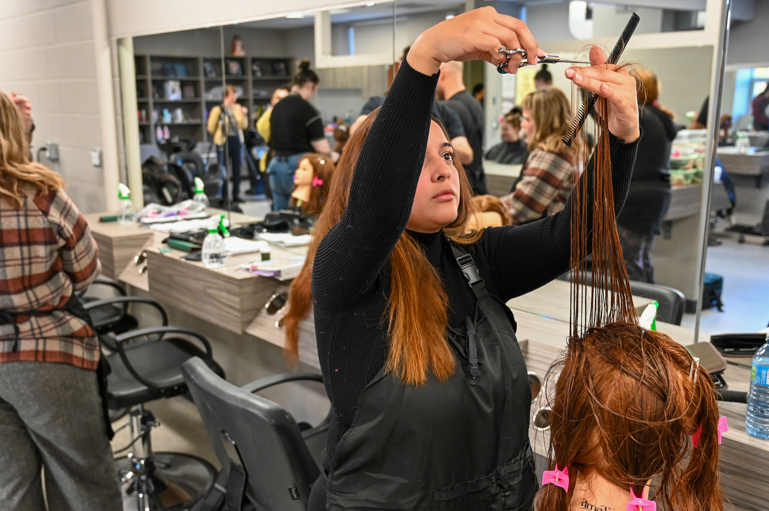 Students practicing hairstyling – St. Louis