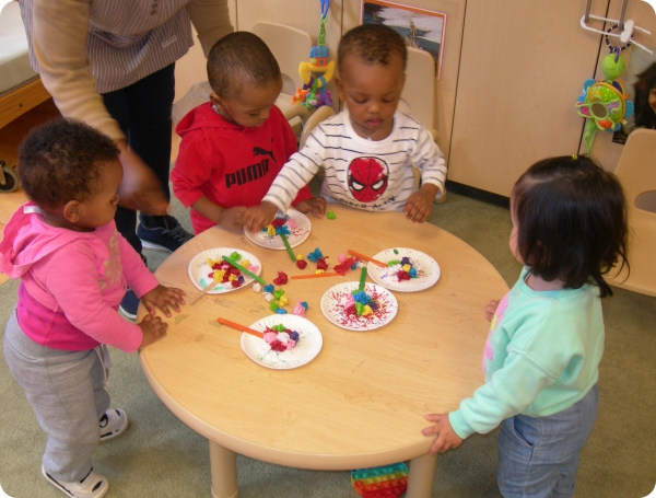 Children playing at the table Children playing at the table