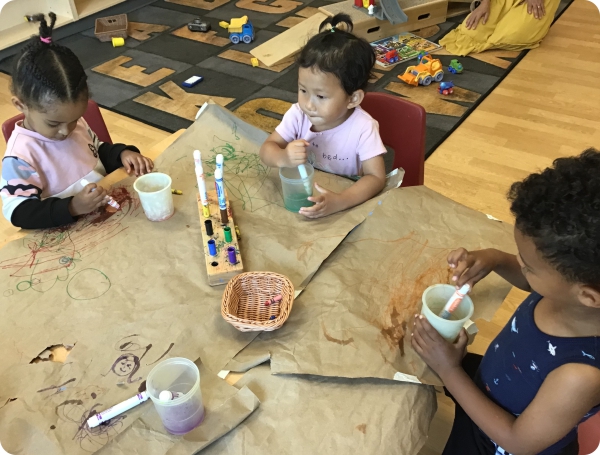 Children playing at the table Children playing at the table