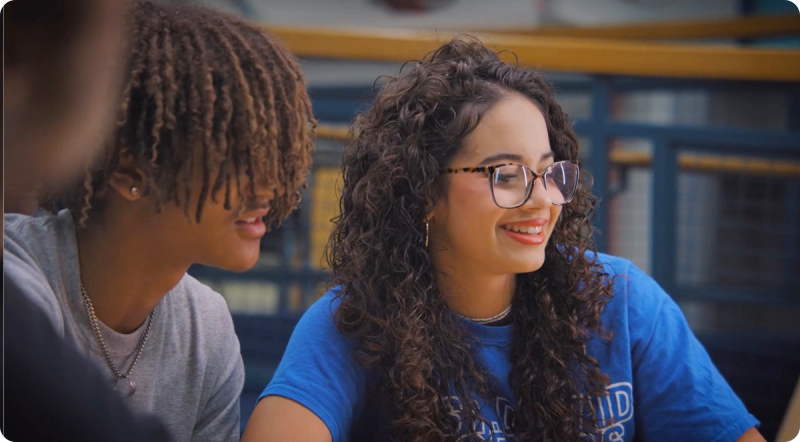 Image of two students in conversation Image of two students in conversation